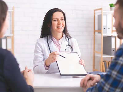 Doctor explaining IVF treatment and prescription details