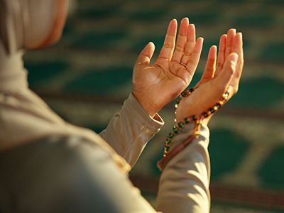 Woman praying in mosque during Ramadan worship