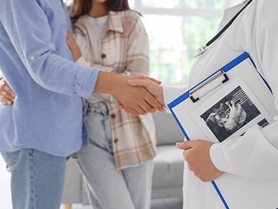 Doctor discussing ultrasound results with a couple